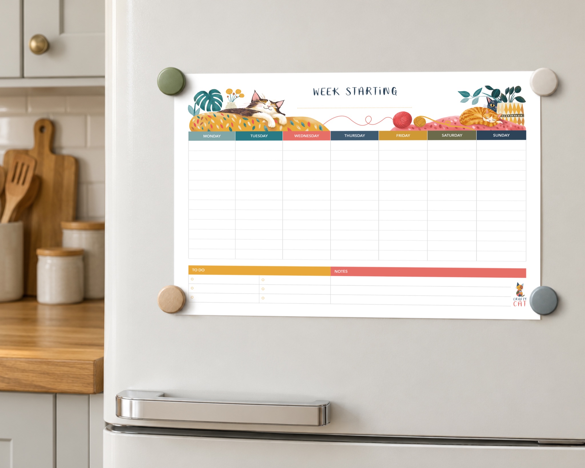 The Crafty Cat weekly planner attached to a kitchen fridge with magnets